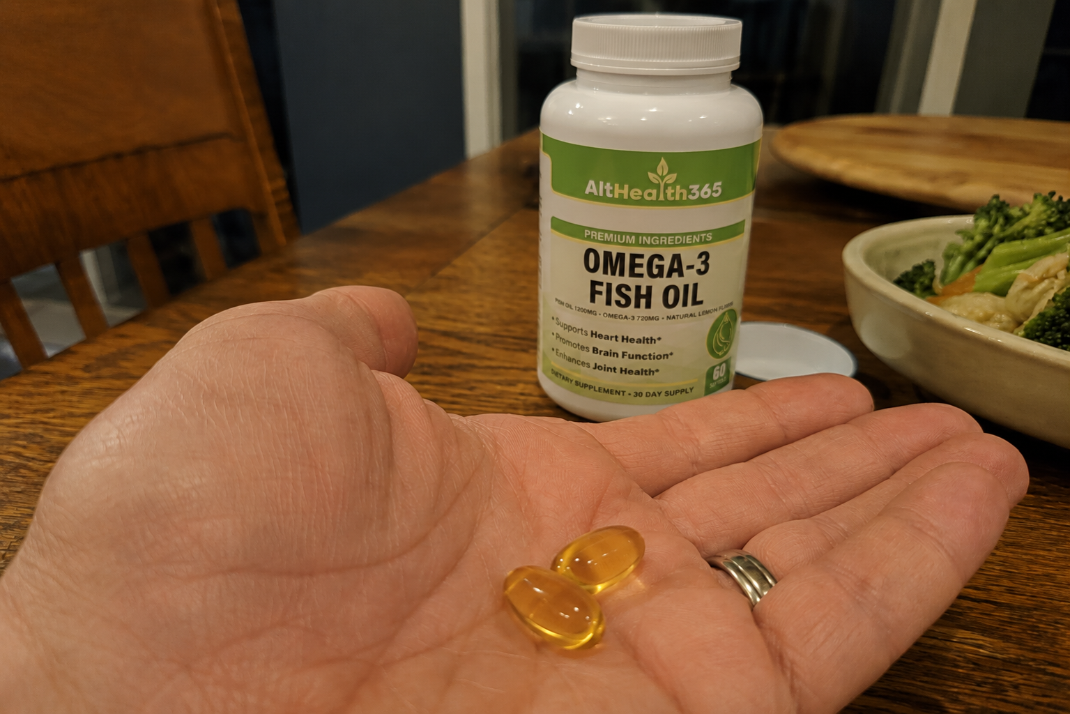 AltHealth365 Omega-3 Fish Oil bottle on a kitchen counter